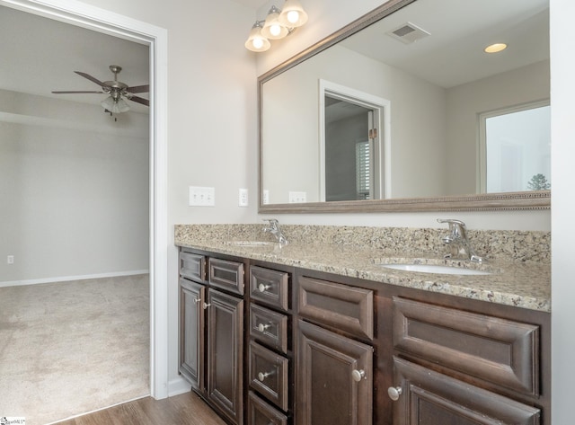 bathroom with ceiling fan, vanity, and hardwood / wood-style flooring