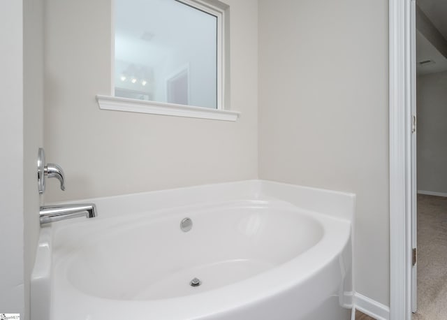 bathroom with a tub to relax in