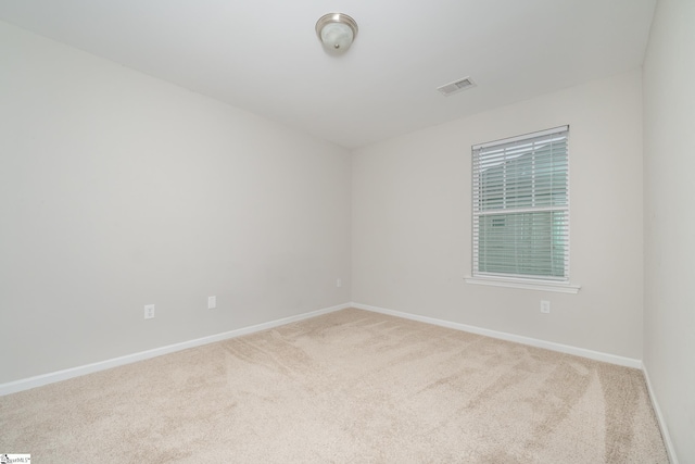 unfurnished room with carpet floors