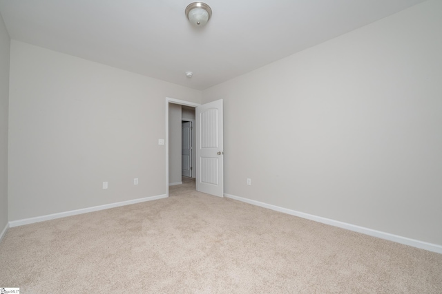 empty room featuring light carpet