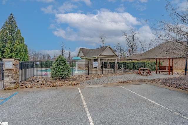 exterior space featuring a community pool and a gazebo