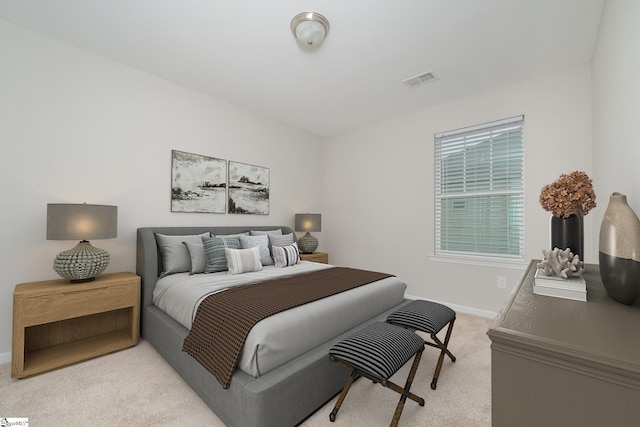 bedroom with light colored carpet