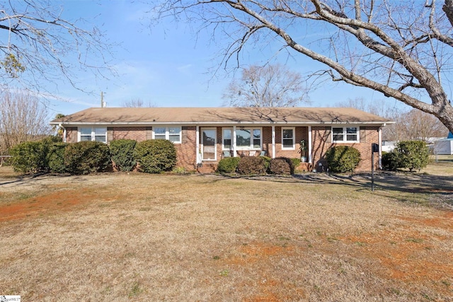 ranch-style house with a front yard