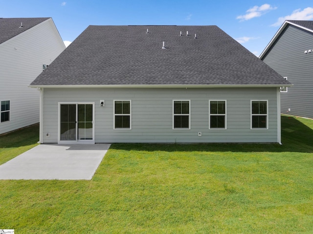 back of property featuring a patio area and a lawn