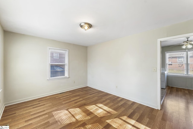 spare room featuring hardwood / wood-style flooring and ceiling fan