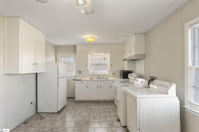 laundry room with washing machine and dryer and sink