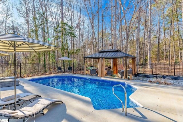 view of swimming pool with a patio and a gazebo