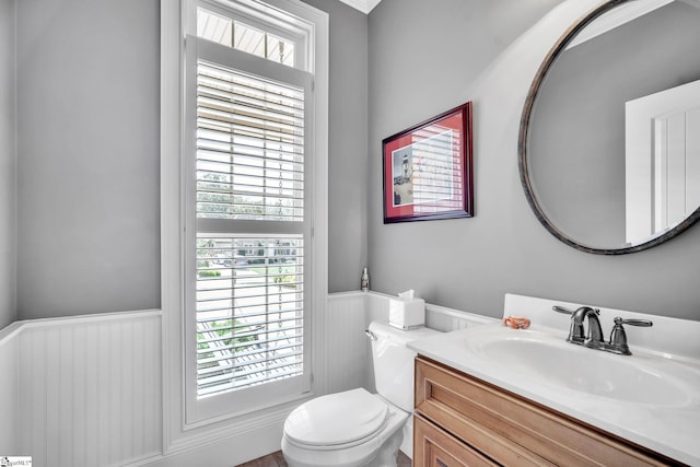 bathroom featuring vanity and toilet