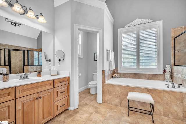 full bathroom featuring vanity, shower with separate bathtub, and toilet