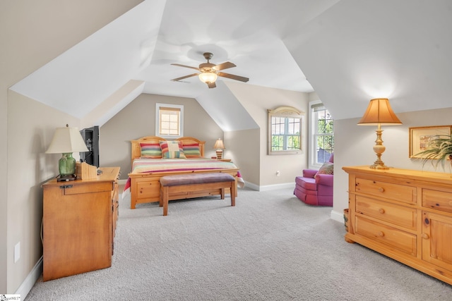 carpeted bedroom with ceiling fan and lofted ceiling