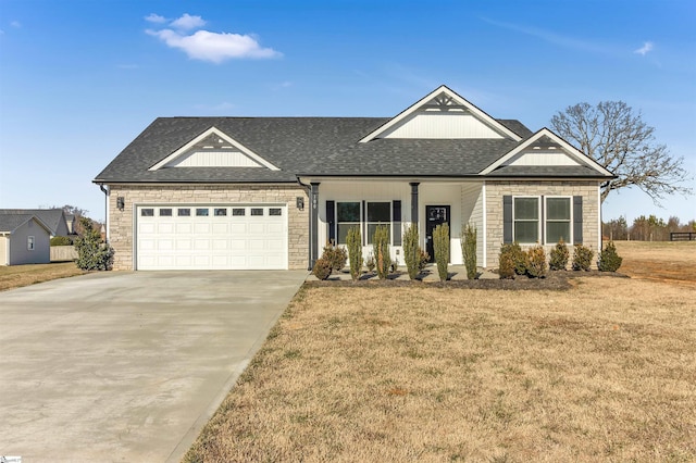 view of front facade featuring a garage and a front lawn