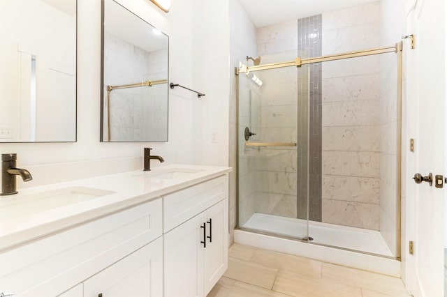 bathroom featuring tile patterned flooring, vanity, and an enclosed shower