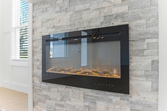 interior details with a stone fireplace