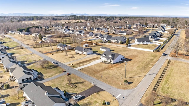 drone / aerial view featuring a mountain view