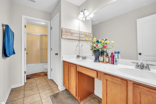 full bathroom with tile patterned flooring, vanity, toilet, and bath / shower combo with glass door