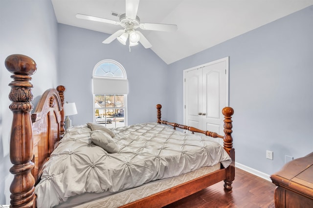 bedroom with ceiling fan, a closet, hardwood / wood-style floors, and lofted ceiling