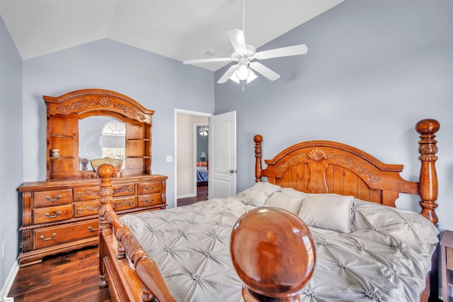 bedroom with dark hardwood / wood-style flooring, vaulted ceiling, and ceiling fan