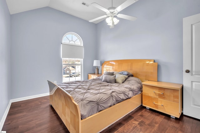 bedroom featuring ceiling fan, dark hardwood / wood-style floors, and vaulted ceiling