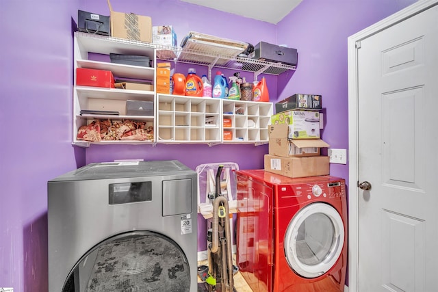 laundry area with washing machine and clothes dryer