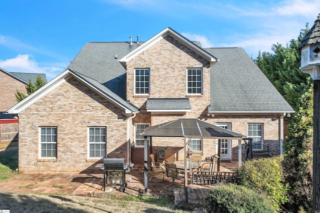 rear view of house with a patio