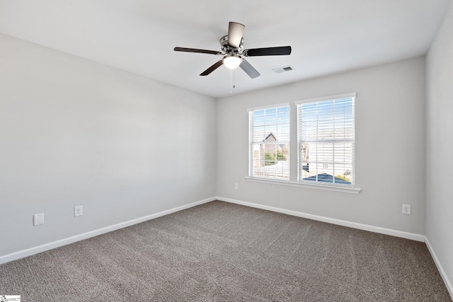 spare room featuring carpet flooring and ceiling fan