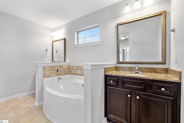 bathroom with a bathtub and vanity