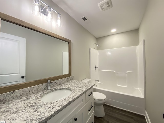 full bathroom with toilet, shower / tub combination, vanity, and hardwood / wood-style floors