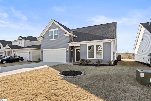 view of front facade featuring a garage, cooling unit, and a front lawn