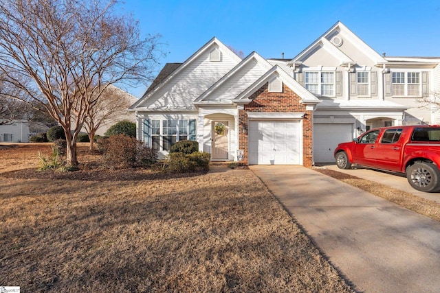 view of front of house with a front yard and a garage