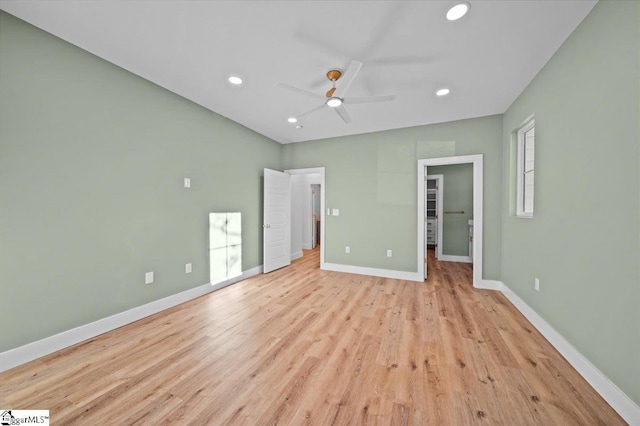 unfurnished bedroom with ceiling fan and light hardwood / wood-style flooring