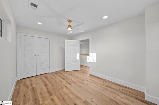 unfurnished bedroom featuring a closet, ceiling fan, and light hardwood / wood-style floors