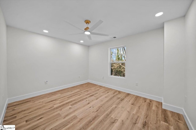 empty room with ceiling fan and light wood-type flooring