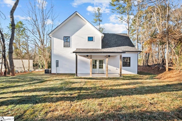 back of house with a yard, ceiling fan, and a patio area