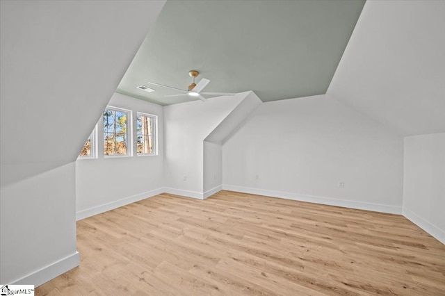 bonus room with ceiling fan, light hardwood / wood-style floors, and lofted ceiling