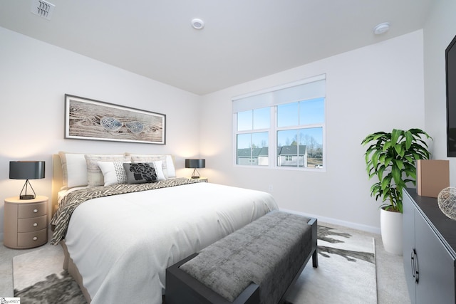 bedroom with light colored carpet