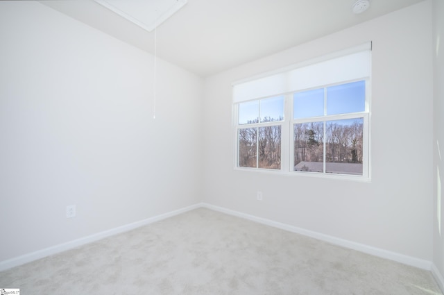 unfurnished room with light carpet