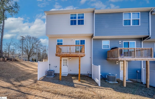 back of house featuring a balcony and central AC unit