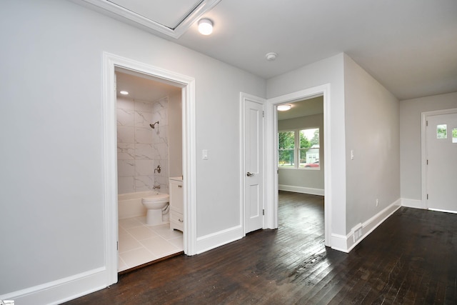 entryway with dark hardwood / wood-style floors