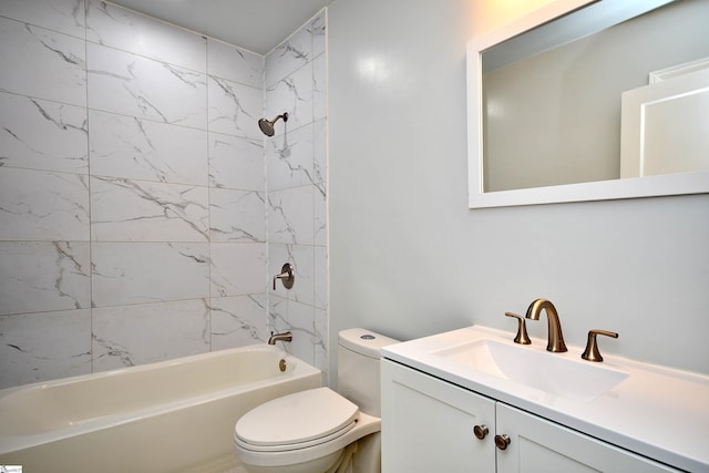 full bathroom featuring toilet, vanity, and tiled shower / bath