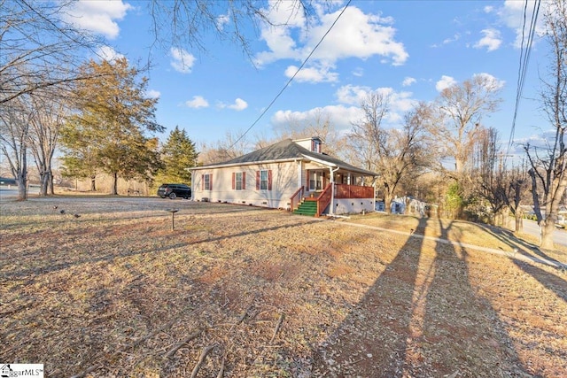 ranch-style house featuring covered porch