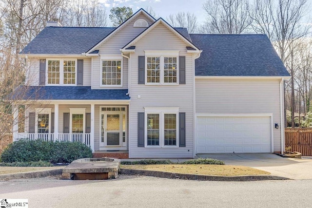 view of front of house featuring a porch and a garage