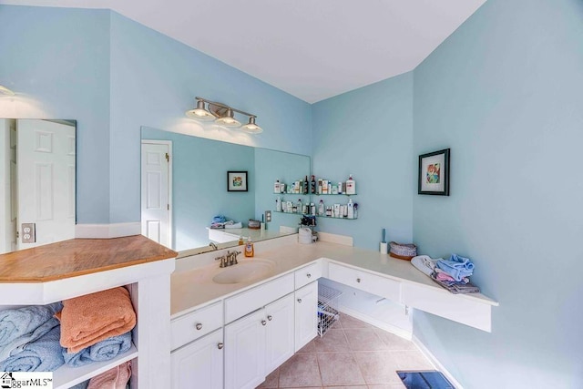 bathroom with tile patterned flooring and vanity