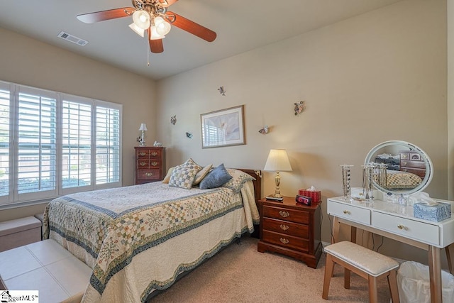 bedroom featuring ceiling fan and multiple windows