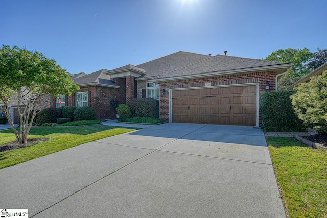 ranch-style home featuring a front yard and a garage