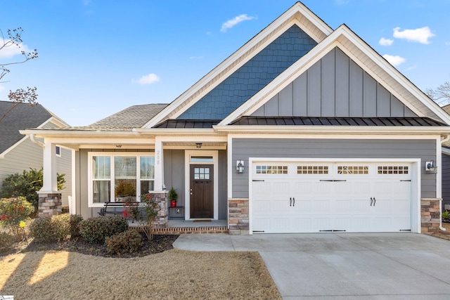 craftsman inspired home featuring a porch and a garage