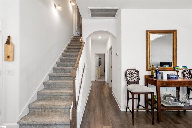 stairway featuring hardwood / wood-style floors