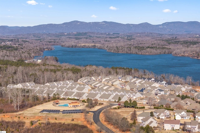 aerial view featuring a water and mountain view