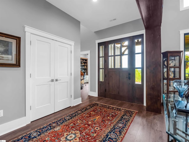 entrance foyer with dark hardwood / wood-style floors