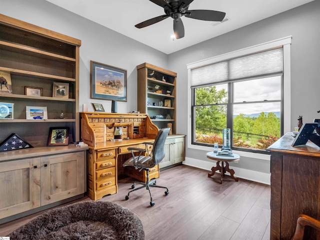 home office with ceiling fan and wood-type flooring