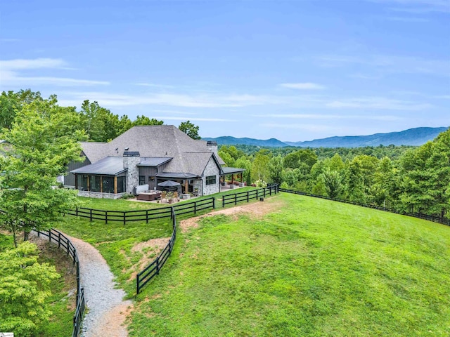 view of yard featuring a rural view and a mountain view